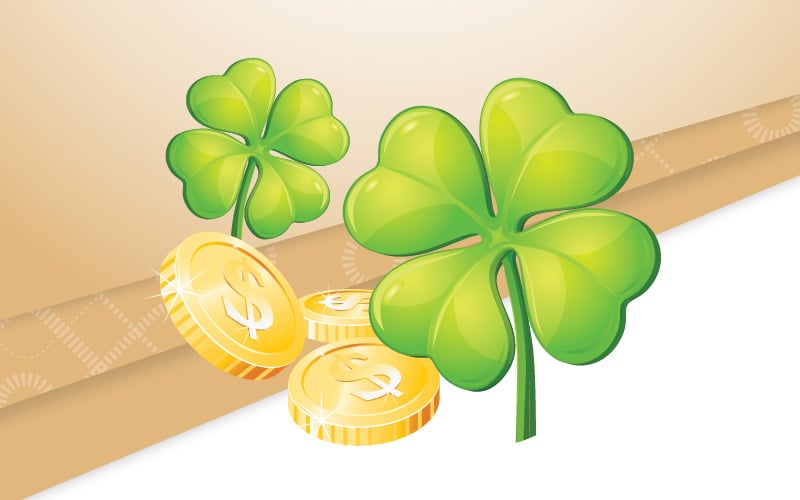 4 leaf clover and gold coins on a gold and white background